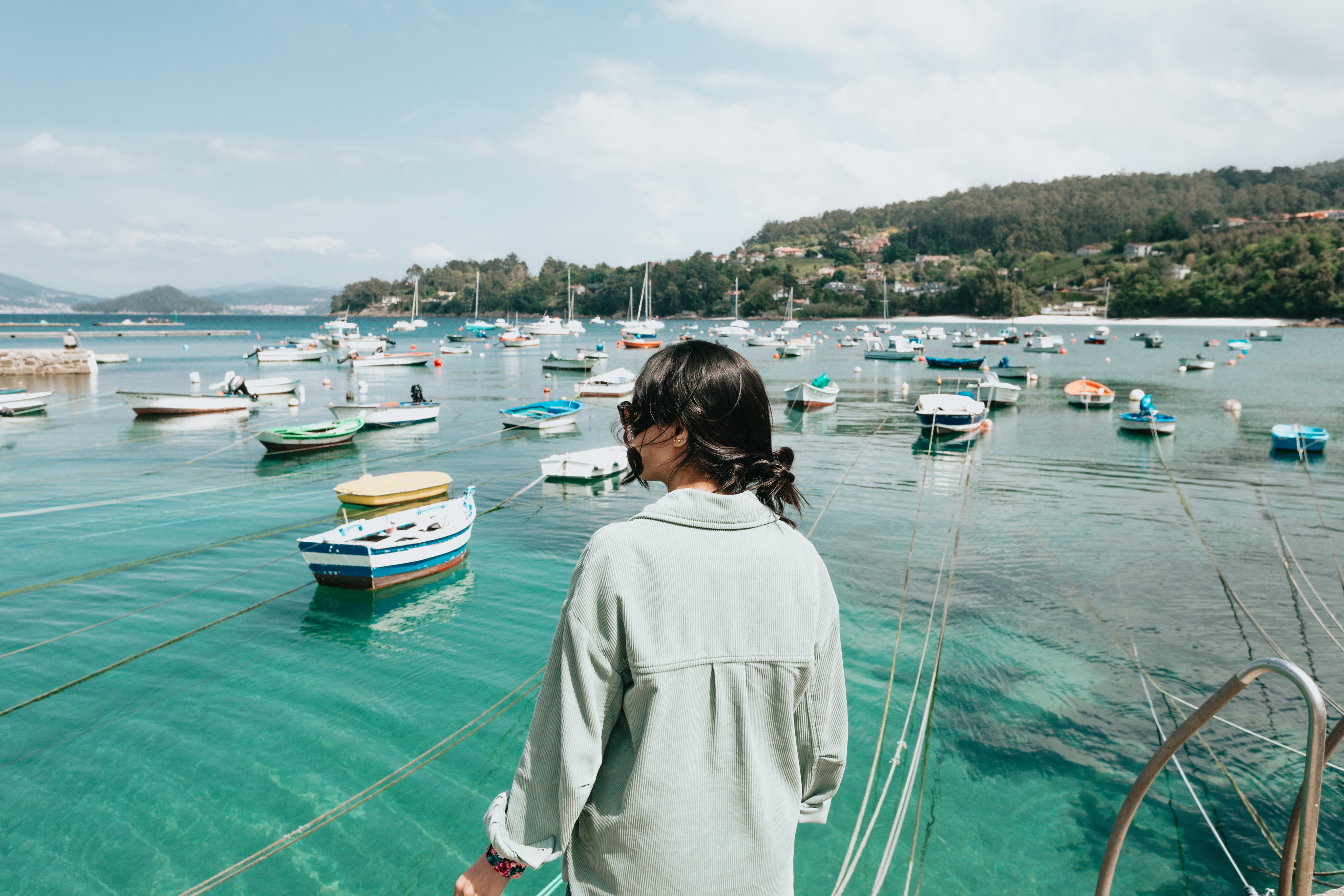 files/person-looks-out-to-aqua-blue-water-filled-with-boats.jpg